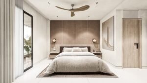 Dormitorio minimalista con cama doble y ventilador de techo