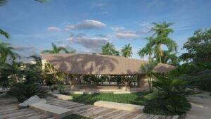 Casa club con tejado de palma rodeada de jardines