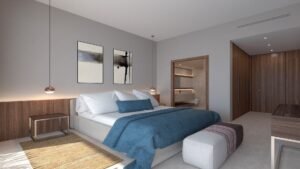 Dormitorio moderno con cama azul y cuadros en la pared